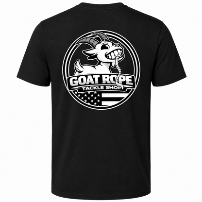 A black short-sleeve t-shirt with a large white circular graphic on the back featuring a cartoon goat holding a rope and the text 'GOAT ROPE TACKLE SHOP' over an American flag design.