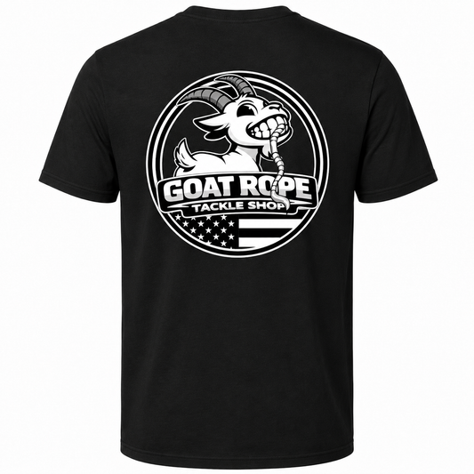 A black short-sleeve t-shirt with a large white circular graphic on the back featuring a cartoon goat holding a rope and the text 'GOAT ROPE TACKLE SHOP' over an American flag design.