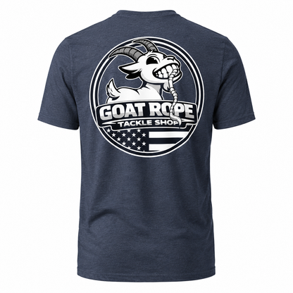 A heather navy blue short-sleeve t-shirt shown from the back, featuring a large circular white graphic print of a cartoon goat head with horns and the text 'GOAT ROPE TACKLE SHOP' over an American flag motif.