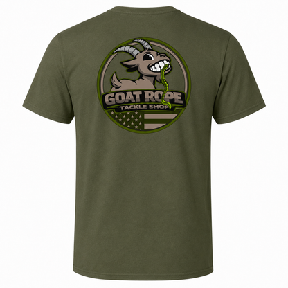 An olive green short-sleeve t-shirt shown from the back, featuring a large circular graphic print of a cartoon goat with horns and the text 'GOAT ROPE TACKLE SHOP' over a circular American flag design.